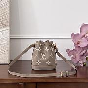 Fortok Louis Vuitton Nano Noé bag in bicolor monogram empreinte leather in the Tourterelle Gray/Crème 13x16x10cm - 1
