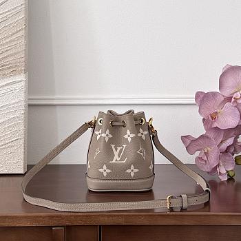 Fortok Louis Vuitton Nano Noé bag in bicolor monogram empreinte leather in the Tourterelle Gray/Crème 13x16x10cm